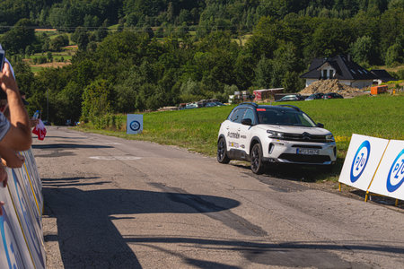 BUDZOW, POLAND - AUGUST 5, 2022: Cycling race "Tour de Pologne" 2022, stage 7 from Skawina to Krakow, professional cyclist riding uphill (KoM in BudzÃ³w)のeditorial素材