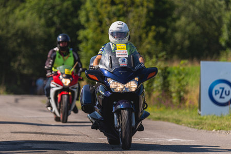 BUDZOW, POLAND - AUGUST 5, 2022: Cycling race "Tour de Pologne" 2022, stage 7 from Skawina to Krakow, professional cyclist riding uphill (KoM in BudzÃ³w)のeditorial素材