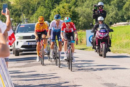 BUDZOW, POLAND - AUGUST 5, 2022: Cycling race "Tour de Pologne" 2022, stage 7 from Skawina to Krakow, professional cyclist riding uphill (KoM in BudzÃ³w)のeditorial素材