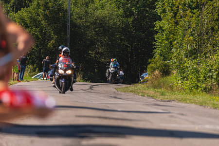 BUDZOW, POLAND - AUGUST 5, 2022: Cycling race "Tour de Pologne" 2022, stage 7 from Skawina to Krakow, professional cyclist riding uphill (KoM in BudzÃ³w)のeditorial素材