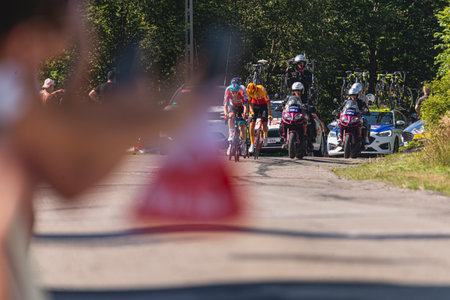 BUDZOW, POLAND - AUGUST 5, 2022: Cycling race "Tour de Pologne" 2022, stage 7 from Skawina to Krakow, professional cyclist riding uphill (KoM in BudzÃ³w)のeditorial素材