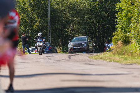 BUDZOW, POLAND - AUGUST 5, 2022: Cycling race "Tour de Pologne" 2022, stage 7 from Skawina to Krakow, professional cyclist riding uphill (KoM in BudzÃ³w)のeditorial素材