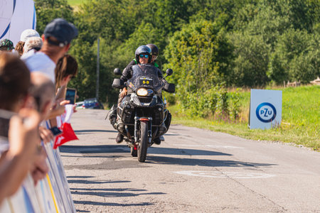 BUDZOW, POLAND - AUGUST 5, 2022: Cycling race "Tour de Pologne" 2022, stage 7 from Skawina to Krakow, professional cyclist riding uphill (KoM in BudzÃ³w)のeditorial素材