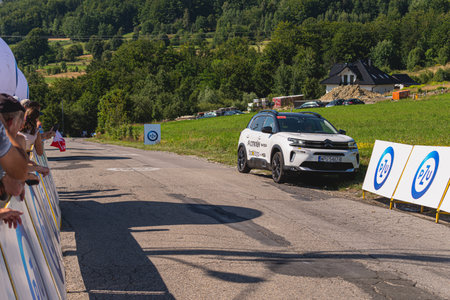 BUDZOW, POLAND - AUGUST 5, 2022: Cycling race "Tour de Pologne" 2022, stage 7 from Skawina to Krakow, professional cyclist riding uphill (KoM in BudzÃ³w)のeditorial素材