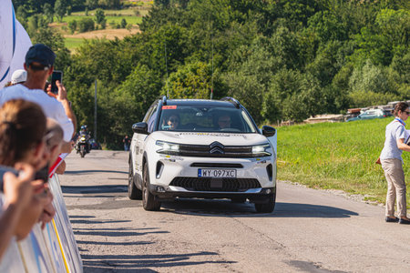 BUDZOW, POLAND - AUGUST 5, 2022: Cycling race "Tour de Pologne" 2022, stage 7 from Skawina to Krakow, professional cyclist riding uphill (KoM in BudzÃ³w)のeditorial素材