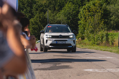 BUDZOW, POLAND - AUGUST 5, 2022: Cycling race "Tour de Pologne" 2022, stage 7 from Skawina to Krakow, professional cyclist riding uphill (KoM in BudzÃ³w)のeditorial素材