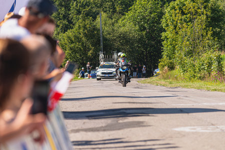 BUDZOW, POLAND - AUGUST 5, 2022: Cycling race "Tour de Pologne" 2022, stage 7 from Skawina to Krakow, professional cyclist riding uphill (KoM in BudzÃ³w)のeditorial素材