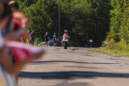 BUDZOW, POLAND - AUGUST 5, 2022: Cycling race "Tour de Pologne" 2022, stage 7 from Skawina to Krakow, professional cyclist riding uphill (KoM in BudzÃ³w)のeditorial素材