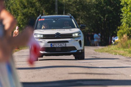 BUDZOW, POLAND - AUGUST 5, 2022: Cycling race "Tour de Pologne" 2022, stage 7 from Skawina to Krakow, professional cyclist riding uphill (KoM in BudzÃ³w)のeditorial素材