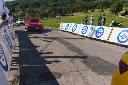 BUDZOW, POLAND - AUGUST 5, 2022: Cycling race "Tour de Pologne" 2022, stage 7 from Skawina to Krakow, professional cyclist riding uphill (KoM in BudzÃ³w)のeditorial素材