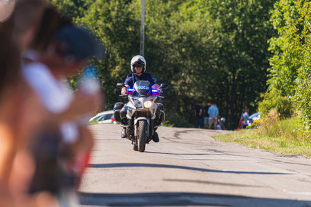 BUDZOW, POLAND - AUGUST 5, 2022: Cycling race "Tour de Pologne" 2022, stage 7 from Skawina to Krakow, professional cyclist riding uphill (KoM in BudzÃ³w)のeditorial素材