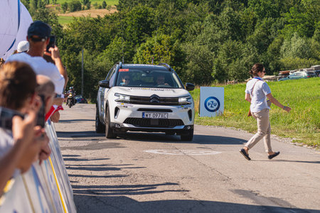 BUDZOW, POLAND - AUGUST 5, 2022: Cycling race "Tour de Pologne" 2022, stage 7 from Skawina to Krakow, professional cyclist riding uphill (KoM in BudzÃ³w)のeditorial素材
