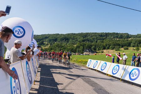 BUDZOW, POLAND - AUGUST 5, 2022: Cycling race "Tour de Pologne" 2022, stage 7 from Skawina to Krakow, professional cyclist riding uphill (KoM in BudzÃ³w)のeditorial素材