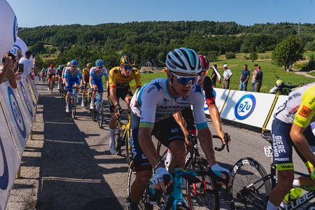 BUDZOW, POLAND - AUGUST 5, 2022: Cycling race "Tour de Pologne" 2022, stage 7 from Skawina to Krakow, professional cyclist riding uphill (KoM in BudzÃ³w)のeditorial素材