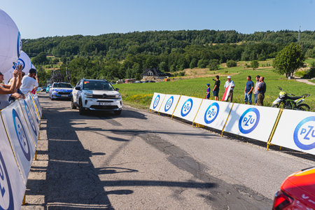 BUDZOW, POLAND - AUGUST 5, 2022: Cycling race "Tour de Pologne" 2022, stage 7 from Skawina to Krakow, professional cyclist riding uphill (KoM in BudzÃ³w)のeditorial素材
