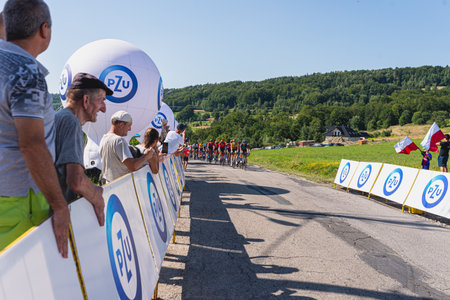 BUDZOW, POLAND - AUGUST 5, 2022: Cycling race "Tour de Pologne" 2022, stage 7 from Skawina to Krakow, professional cyclist riding uphill (KoM in BudzÃ³w)のeditorial素材