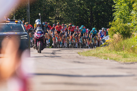BUDZOW, POLAND - AUGUST 5, 2022: Cycling race "Tour de Pologne" 2022, stage 7 from Skawina to Krakow, professional cyclist riding uphill (KoM in BudzÃ³w)のeditorial素材