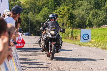 BUDZOW, POLAND - AUGUST 5, 2022: Cycling race "Tour de Pologne" 2022, stage 7 from Skawina to Krakow, professional cyclist riding uphill (KoM in BudzÃ³w)のeditorial素材