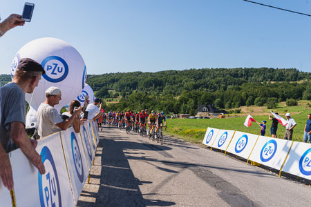BUDZOW, POLAND - AUGUST 5, 2022: Cycling race "Tour de Pologne" 2022, stage 7 from Skawina to Krakow, professional cyclist riding uphill (KoM in BudzÃ³w)のeditorial素材