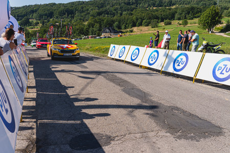 BUDZOW, POLAND - AUGUST 5, 2022: Cycling race "Tour de Pologne" 2022, stage 7 from Skawina to Krakow, professional cyclist riding uphill (KoM in BudzÃ³w)のeditorial素材