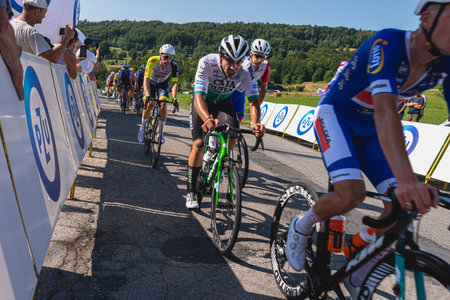 BUDZOW, POLAND - AUGUST 5, 2022: Cycling race "Tour de Pologne" 2022, stage 7 from Skawina to Krakow, professional cyclist riding uphill (KoM in BudzÃ³w)のeditorial素材