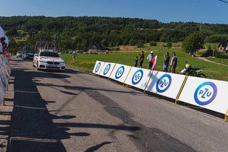 BUDZOW, POLAND - AUGUST 5, 2022: Cycling race "Tour de Pologne" 2022, stage 7 from Skawina to Krakow, professional cyclist riding uphill (KoM in BudzÃ³w)のeditorial素材