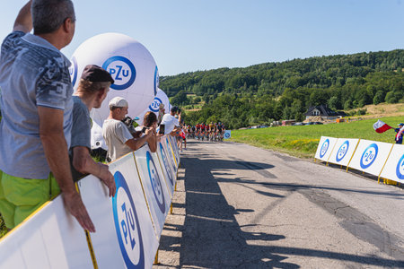 BUDZOW, POLAND - AUGUST 5, 2022: Cycling race "Tour de Pologne" 2022, stage 7 from Skawina to Krakow, professional cyclist riding uphill (KoM in BudzÃ³w)のeditorial素材