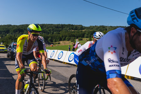 BUDZOW, POLAND - AUGUST 5, 2022: Cycling race "Tour de Pologne" 2022, stage 7 from Skawina to Krakow, professional cyclist riding uphill (KoM in BudzÃ³w)のeditorial素材
