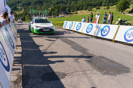 BUDZOW, POLAND - AUGUST 5, 2022: Cycling race "Tour de Pologne" 2022, stage 7 from Skawina to Krakow, professional cyclist riding uphill (KoM in BudzÃ³w)のeditorial素材
