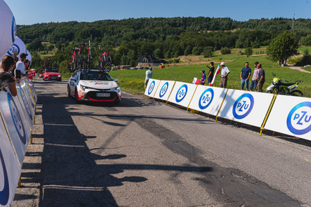 BUDZOW, POLAND - AUGUST 5, 2022: Cycling race "Tour de Pologne" 2022, stage 7 from Skawina to Krakow, professional cyclist riding uphill (KoM in BudzÃ³w)のeditorial素材