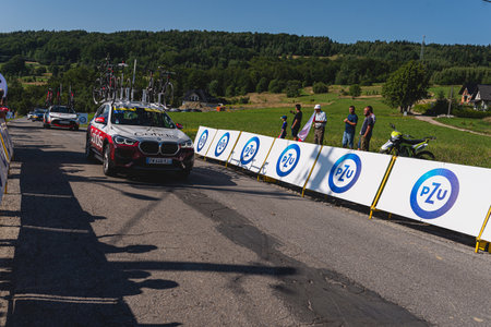 BUDZOW, POLAND - AUGUST 5, 2022: Cycling race "Tour de Pologne" 2022, stage 7 from Skawina to Krakow, professional cyclist riding uphill (KoM in BudzÃ³w)のeditorial素材