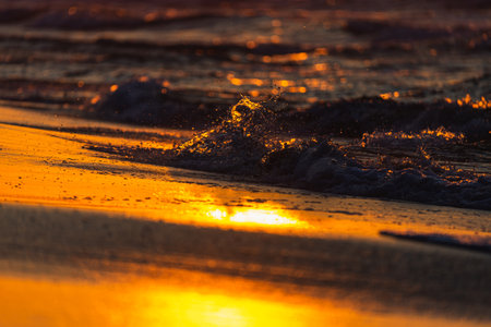 Photo of Stormy waves on Baltic Sea. golden hour.の写真素材