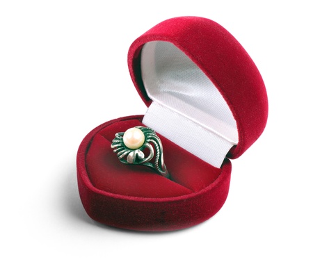 Silver ring with pearl in red case isolated on white background