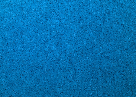 Closeup view of a blue sponge textureの写真素材