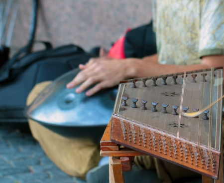 Street musicians playing on asian traditional music instrumentsの写真素材