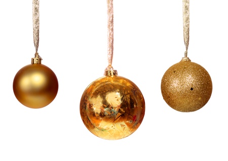 Three golden balls isolated on white backgroundの写真素材
