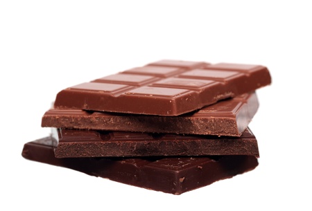 Stack of milk and dark chocolate isolated on white background