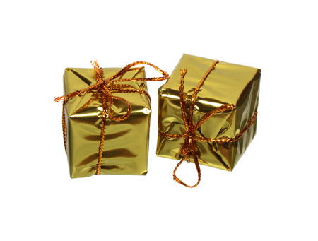 Two golden gift boxes isolated on white backgroundの写真素材