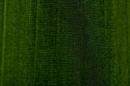 Green texture with silky fabric with vertical linesの写真素材