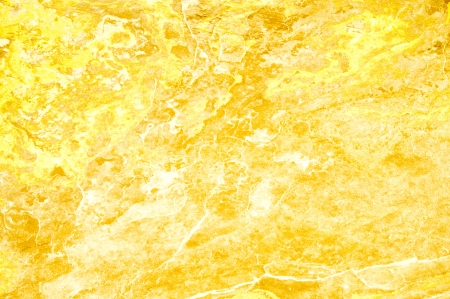Antique gold-colored paper and sandstoneの写真素材