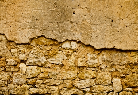 Brown old wall with plaster and bricksの写真素材