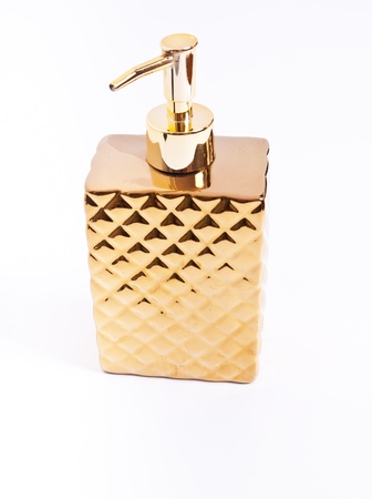 Cosmetic bottle in goldの写真素材