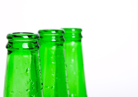 Three green bottles of chilled beerの写真素材