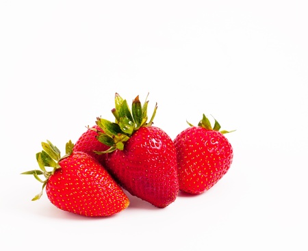 Many juicy strawberries on isolated backgroundの写真素材