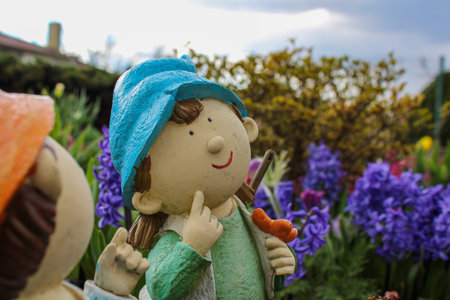 Smiling dwarf in colorful gardenの写真素材