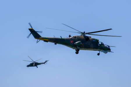 Slovak fighter helicopters on blue sky in formationのeditorial素材