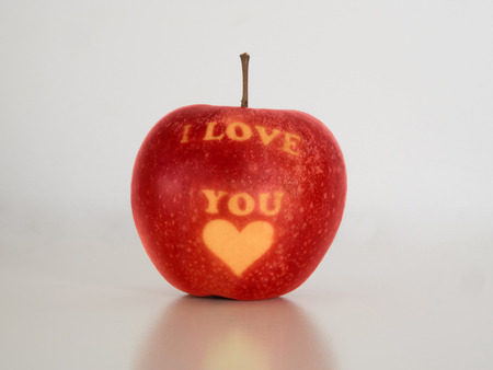 I love you apple. Single apple on a white background. Love, Valentine's day concepts.の写真素材