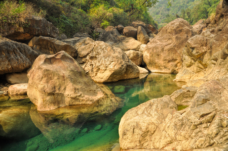 Clear turquoise water of stream in Meghalaya, Indiaの写真素材