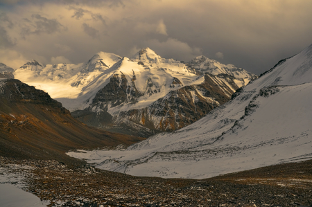 Scenic view of cloudy Wakhan valley in Tajikistan with snowy mountain peaks of Pamir and Karakoramの写真素材