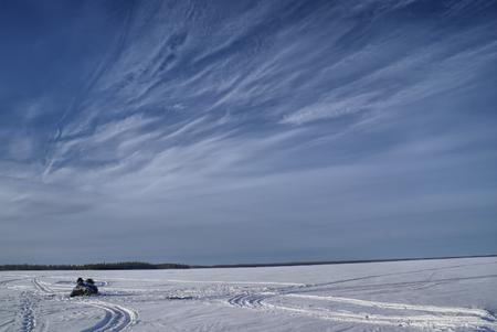 Panoramic view of tracks left in snow on a snowy plainの写真素材